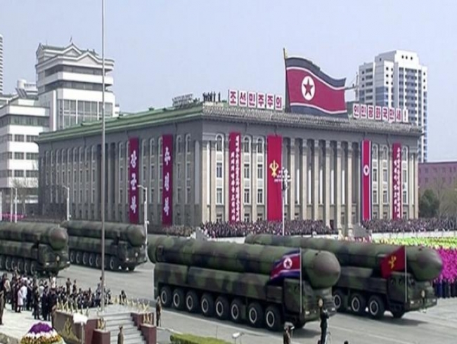 North Korea marks founder's birthday with military parade, rolls out missiles