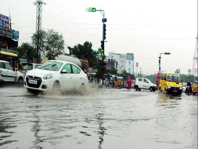 Rains flood Hyderabad roads, more showers for Telangana