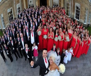 This couple had 130 bridesmaids and 103 ushers on their wedding!