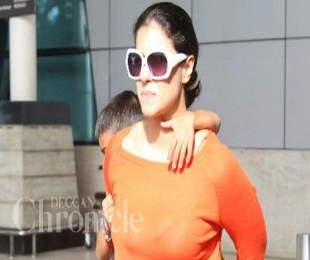 Supermom Kajol offers son a piggyback ride while leaving airport